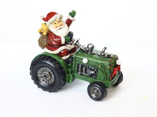 Santa on Tractor Statue